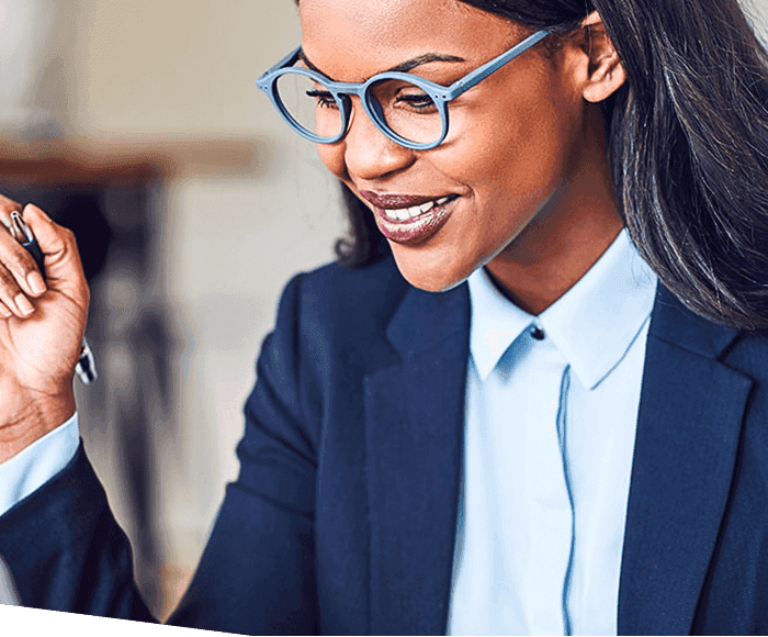 Woman in suit holding a pen